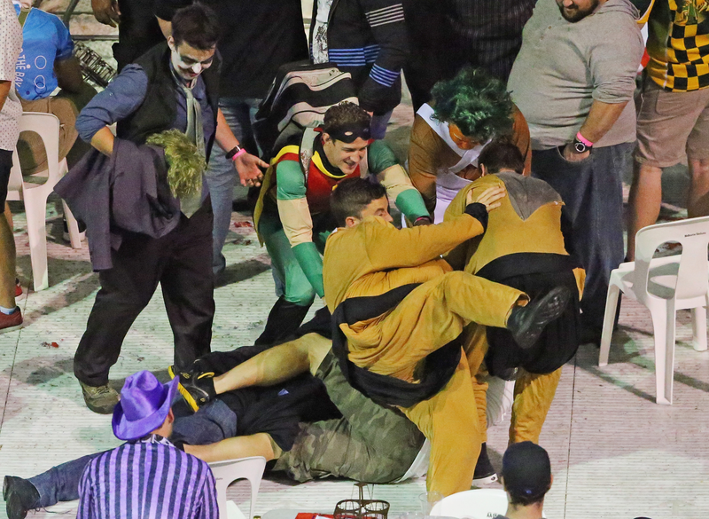 Illustration for article titled Rioting Costumed Fans Halt Australian Darts Competition